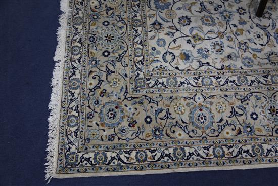 A Tabriz cream ground carpet, 12ft 6in. by 9ft 9in.